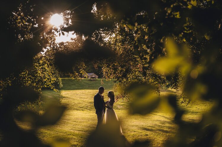 bride and groom photos in the golden hour at Bredenbury Court barns