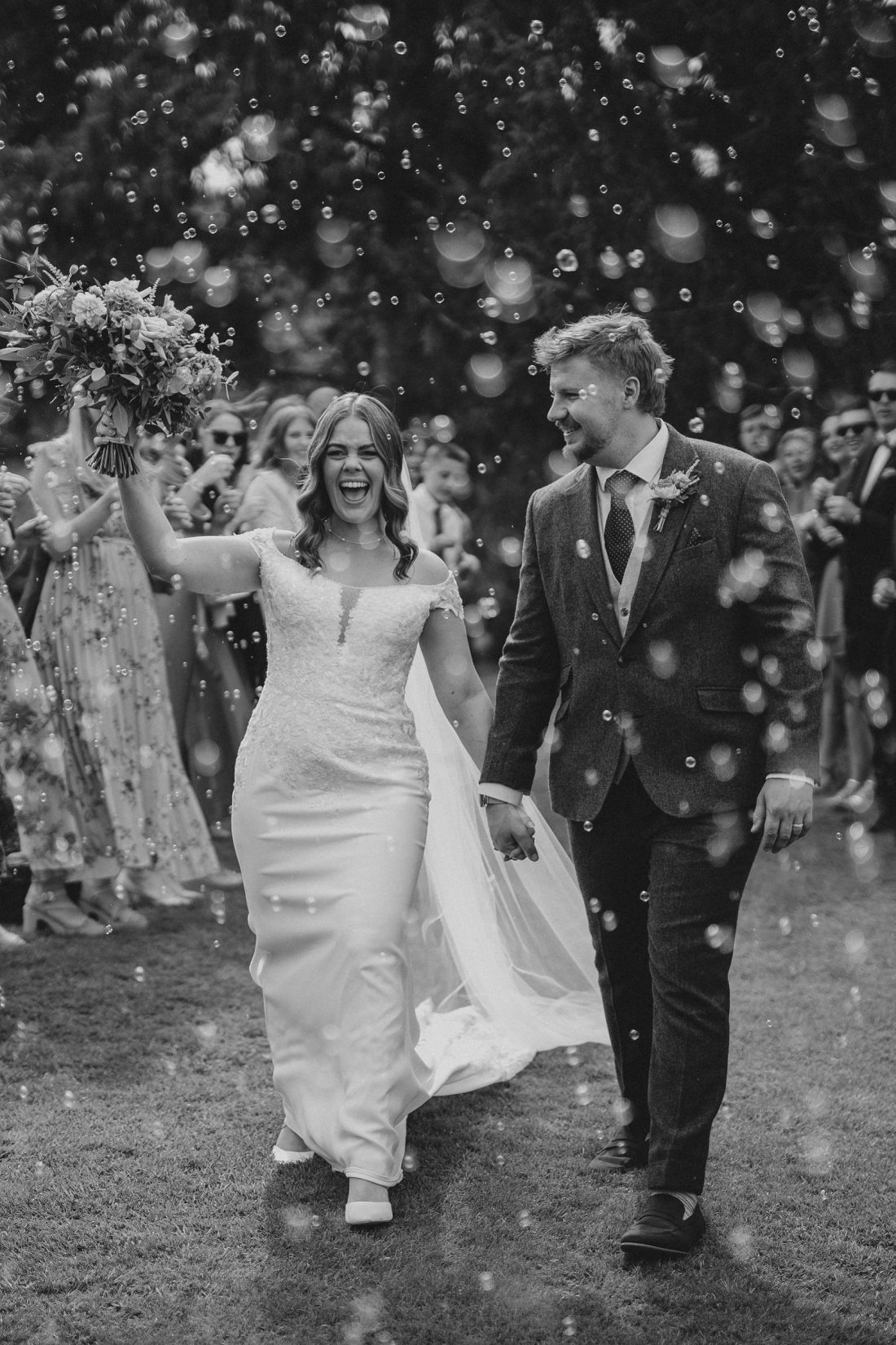 bride and groom enjoying bubble confetti alternative at Birtsmorton court