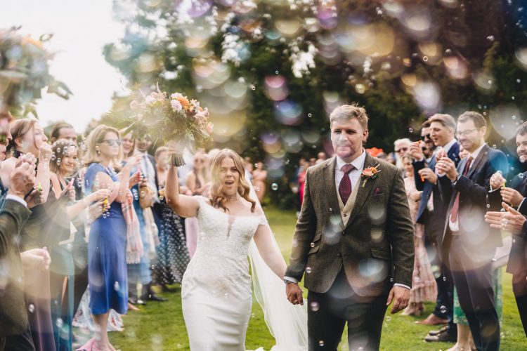 bride and groom enjoying bubble confetti alternative at Birtsmorton court