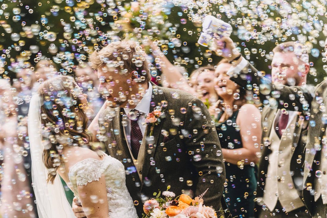 bride and groom enjoying bubble confetti alternative at Birtsmorton court