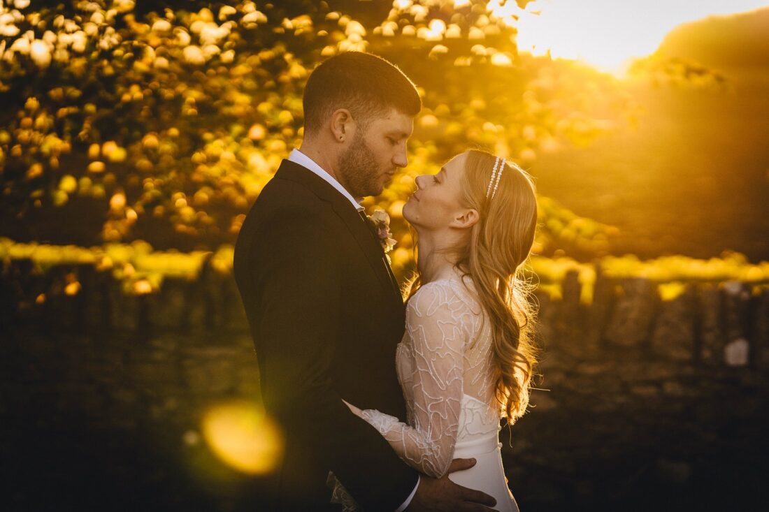 bride and groom in the golden light at Lapstone barn