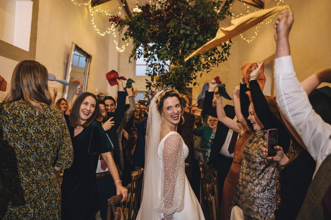 bride and groom enter the wedding breakfast at merriscourt