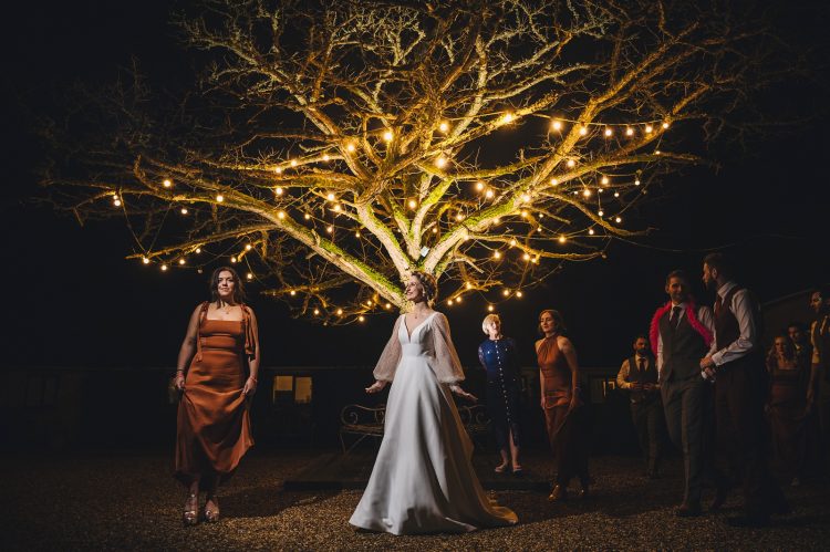 the courtyard at merrisocurt at night with fairy lights and sparklers