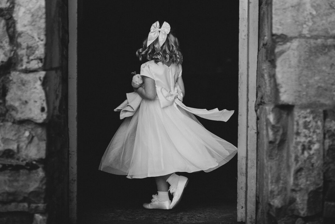 flower girl dancing in the courtyard