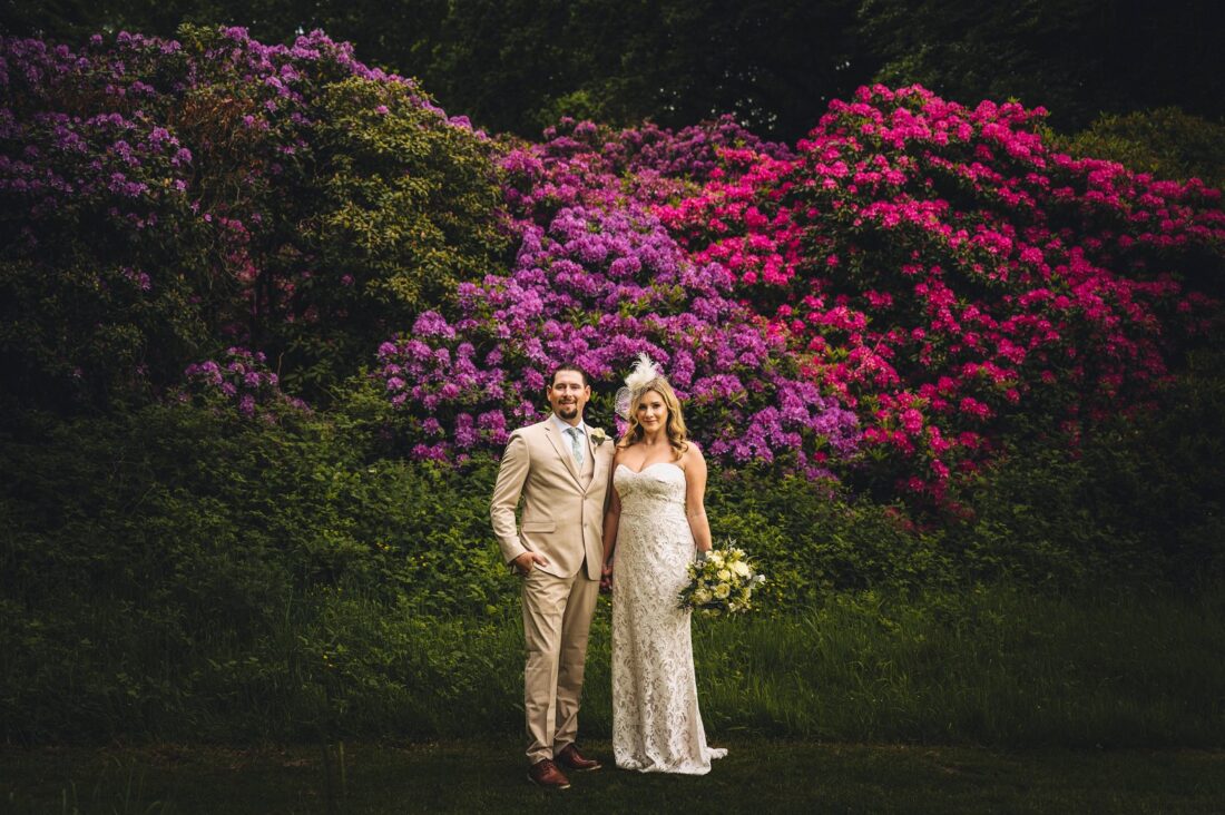 couple posing in the gardens at Bowood wedding venue