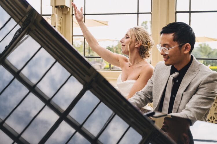 bride singing during her wedding breakfast and speeches at Kilworth House