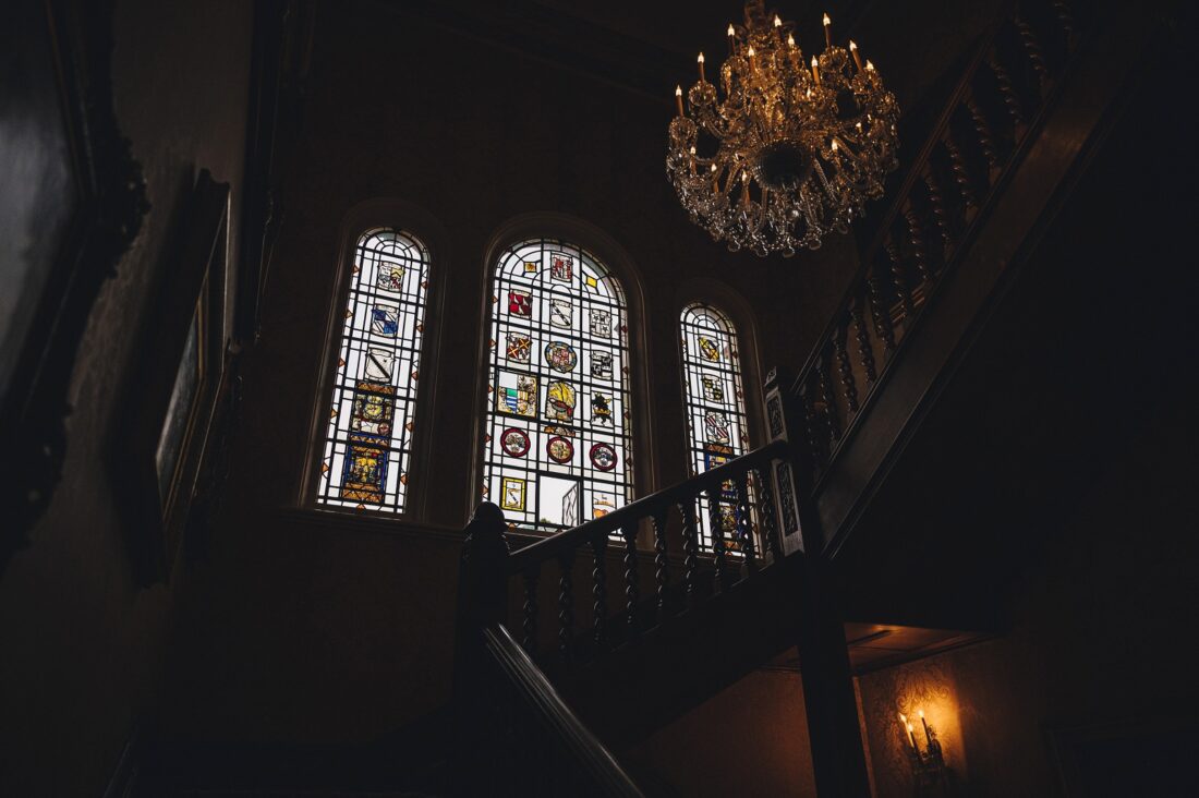 stained glass windows at Kilworth House are a perfect backdrop for wedding photography