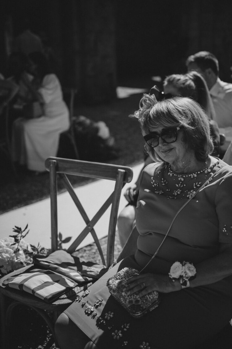 bride's mum waiting before the ceremony at San Galgano, Tuscany