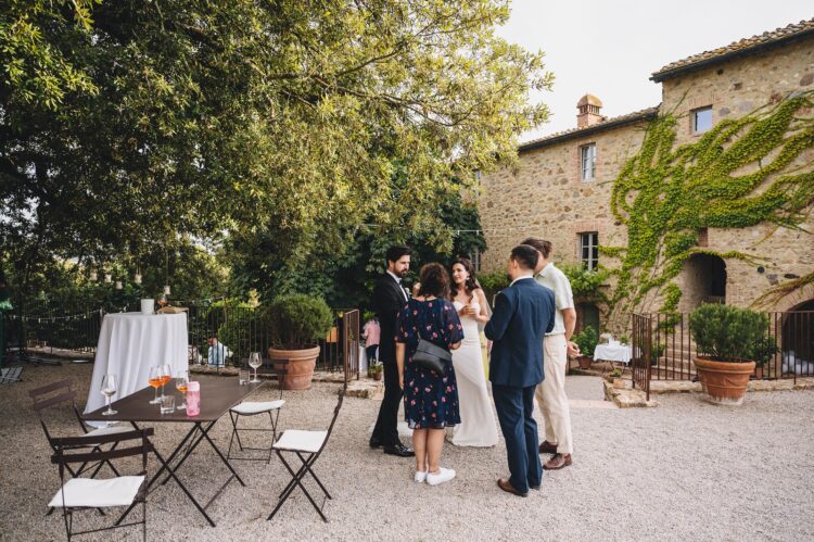 wedding guests chat to the bride