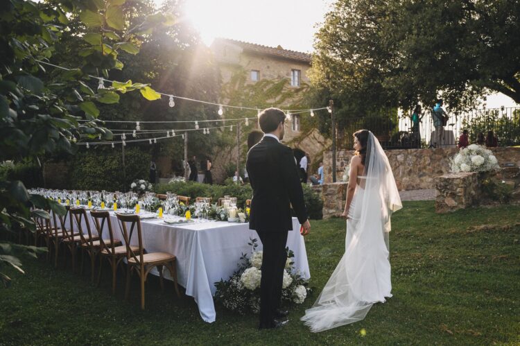 bride and groom looking at the tables before wedding breakfast at Villa Podernovo