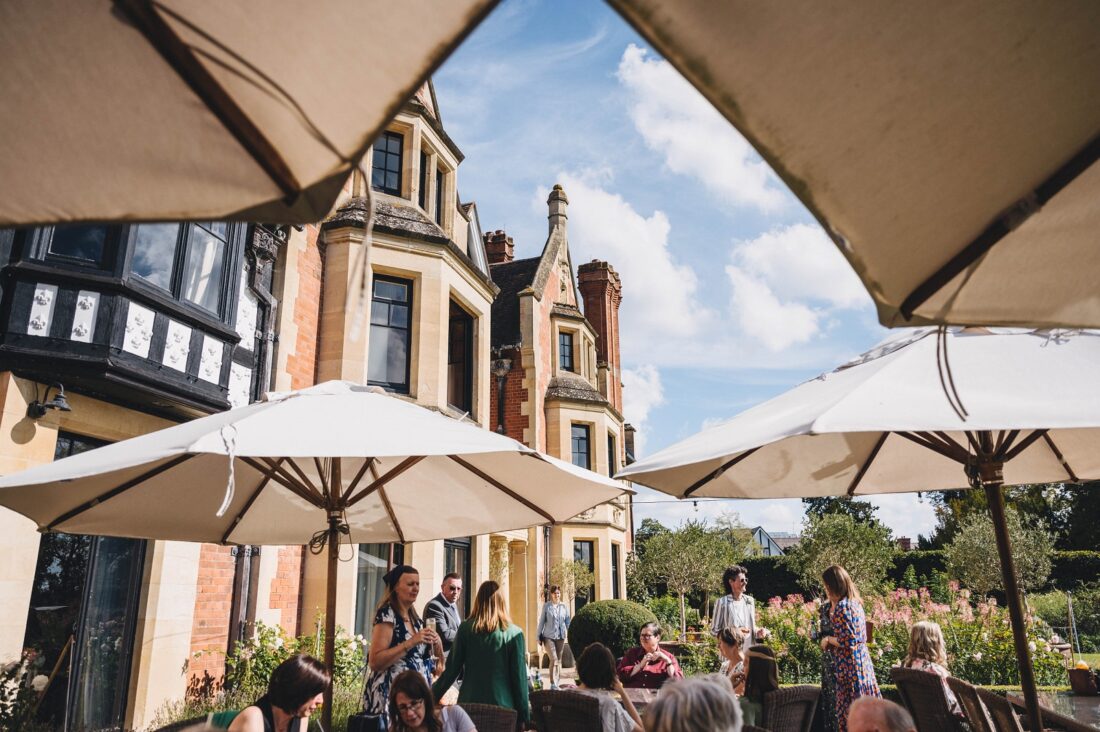 wedding guests enjoying reception drinks at the wood norton wedding venue