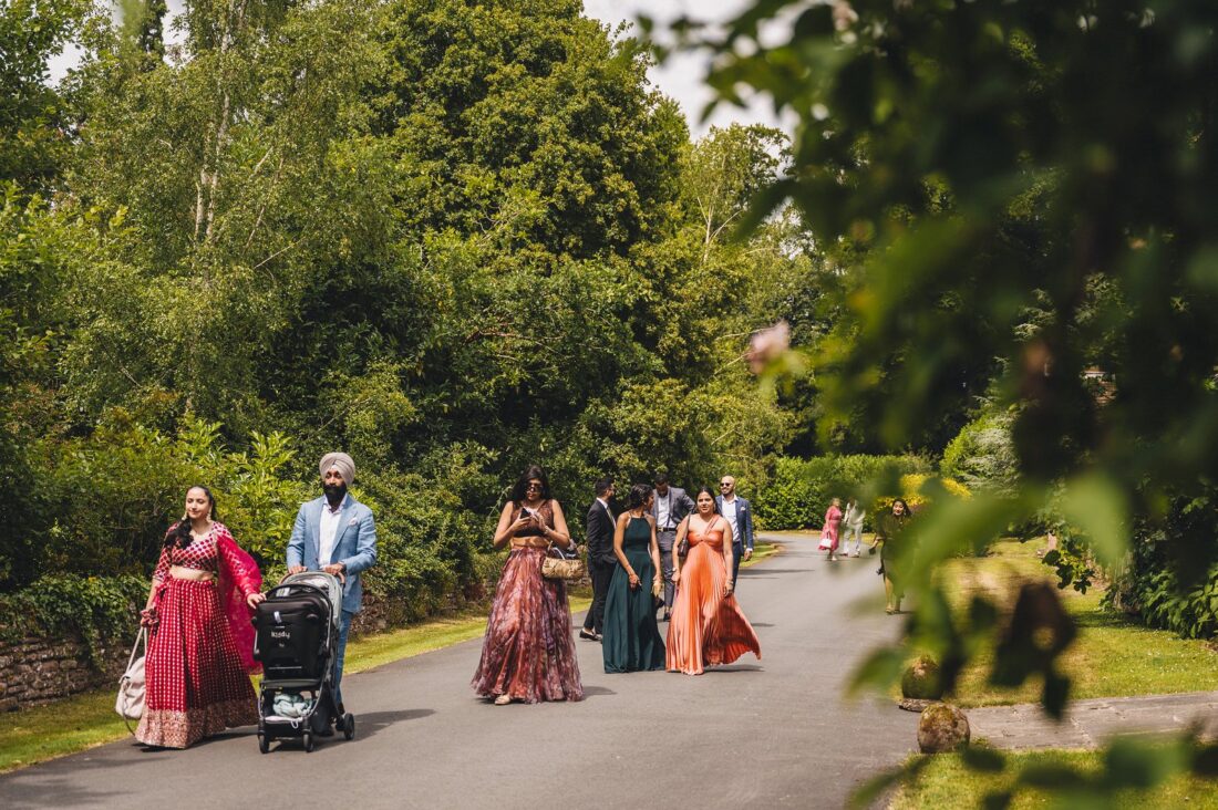 LGBTQ wedding photographer guests arriving at hindu wedding