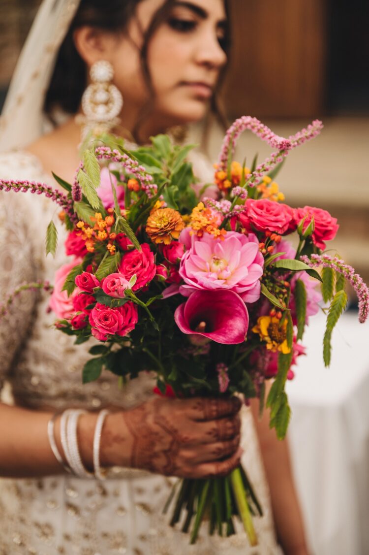LGBTQ wedding photographer hindu bride flowers