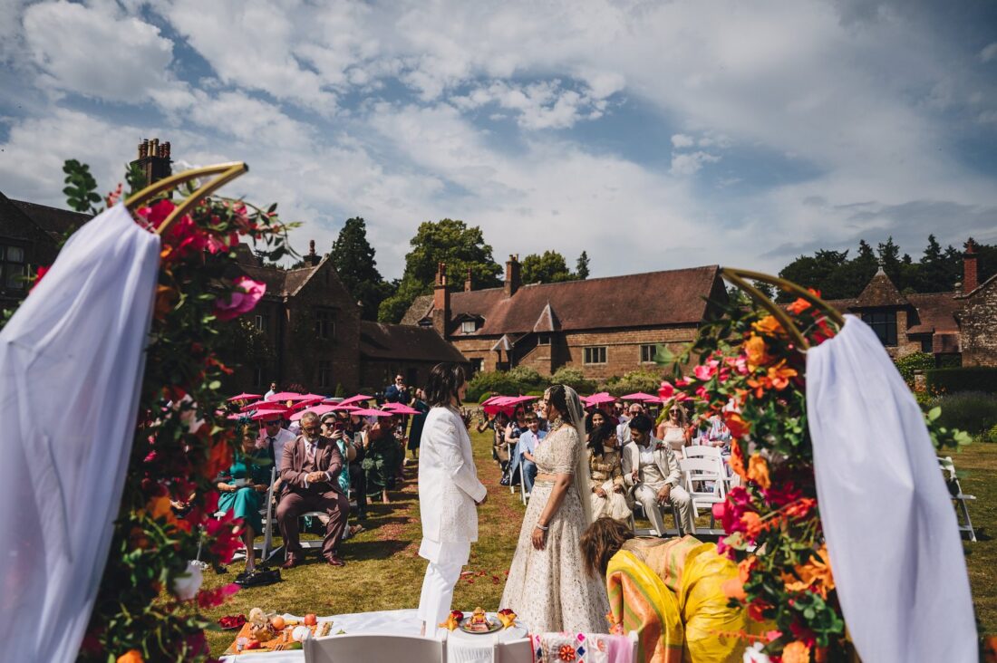 LGBTQ wedding photographer outdoor hindu wedding ceremony at How Caple Court