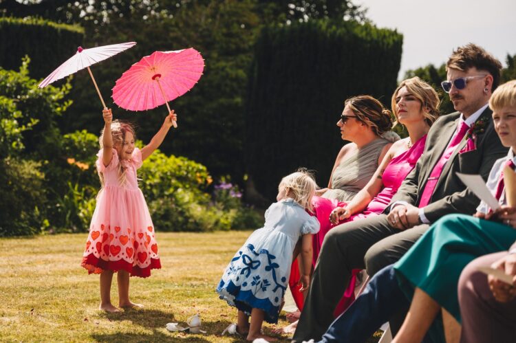 LGBTQ wedding photographer guests at outdoor hindu wedding ceremony at How Caple Court