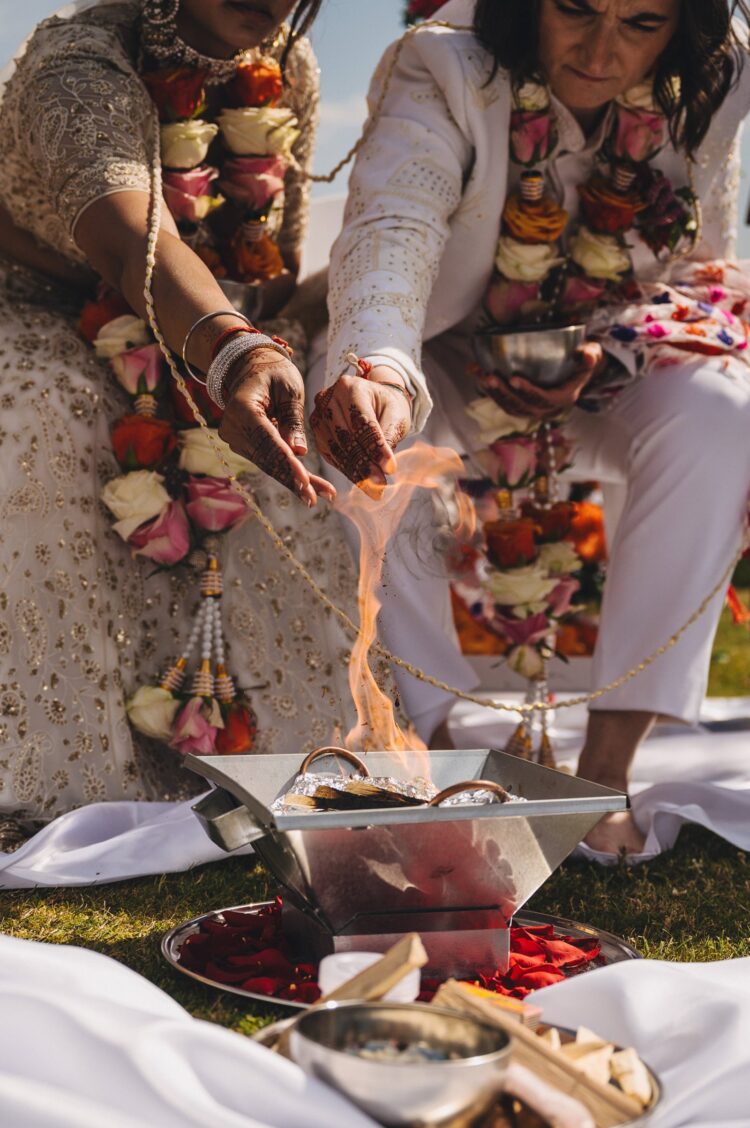 LGBTQ wedding photographer outdoor hindu wedding ceremony at How Caple Court