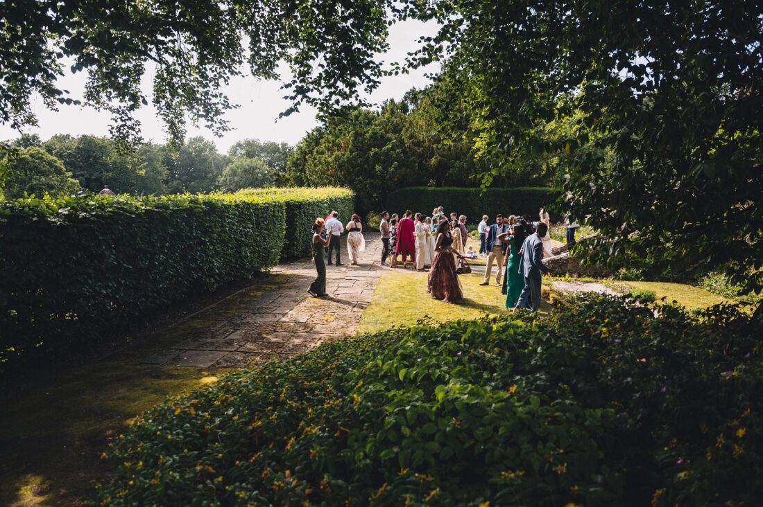 guests enjoying reception drinks at How Caple Court wedding venue in Herefordshire