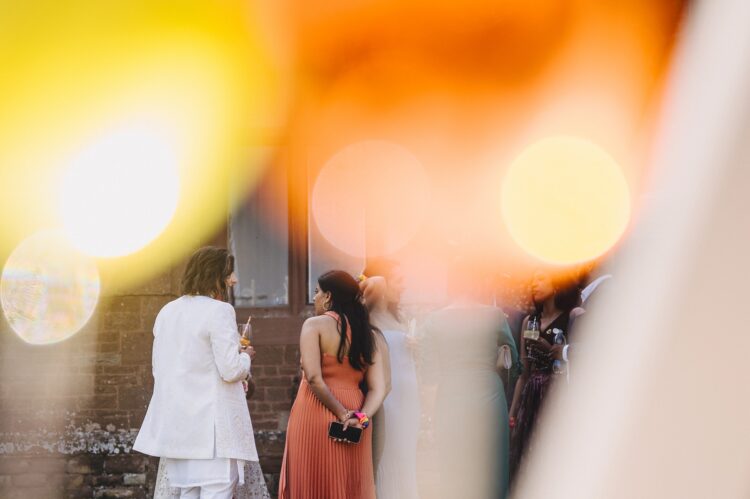 guests enjoying reception drinks at How Caple Court wedding venue in Herefordshire