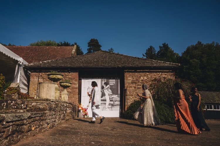 guests enjoying reception drinks at How Caple Court wedding venue in Herefordshire