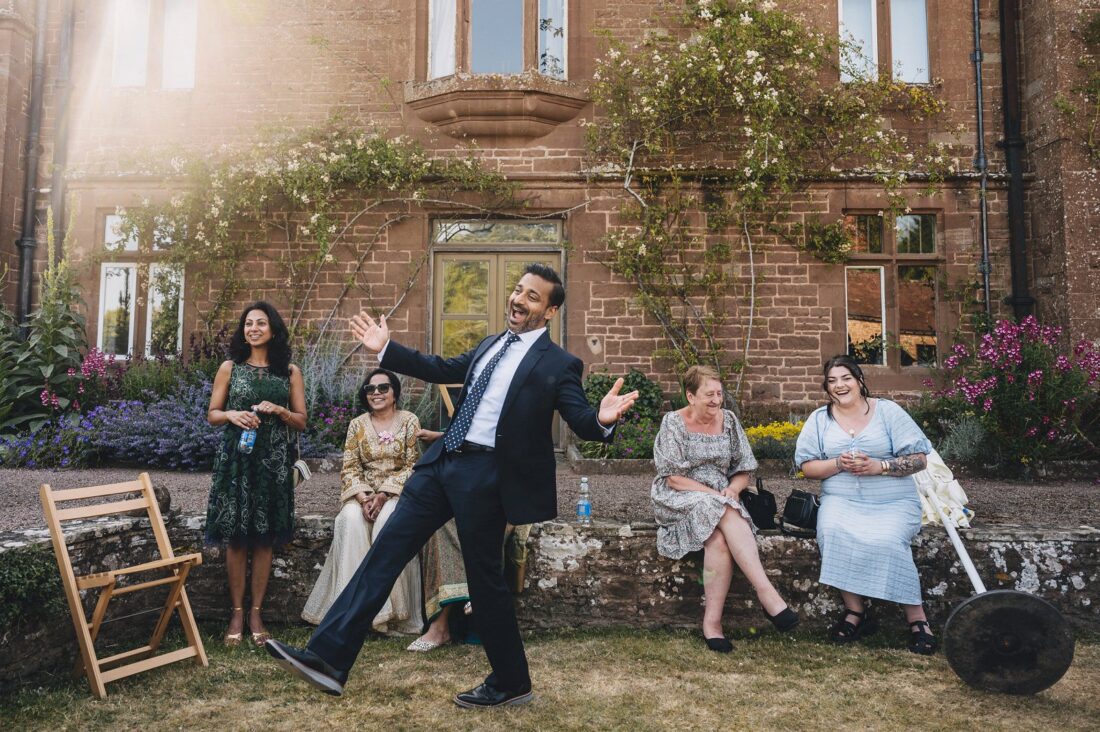 guests enjoying reception drinks at How Caple Court wedding venue in Herefordshire
