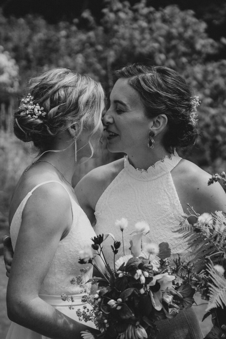 LGBTQ wedding photographer two brides radiating happiness and love