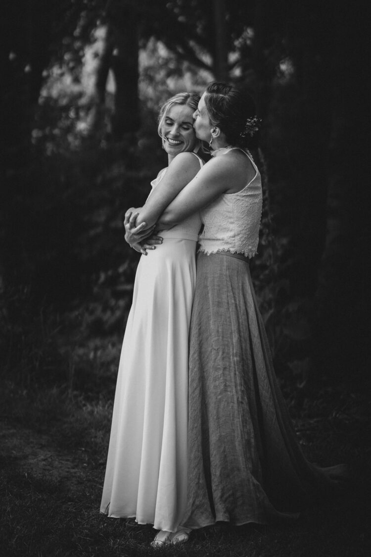 LGBTQ wedding photographer two brides radiating happiness and love