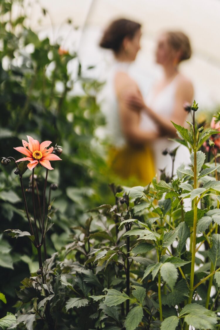 LGBTQ wedding photographer two brides radiating happiness and love