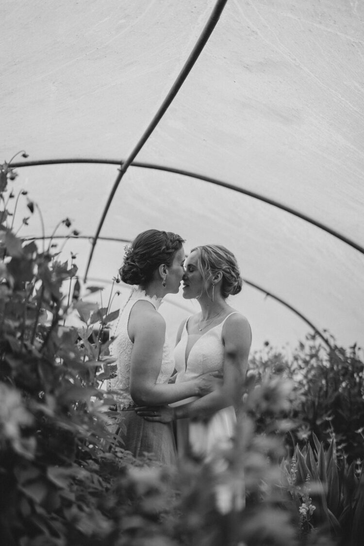 LGBTQ wedding photographer two brides radiating happiness and love