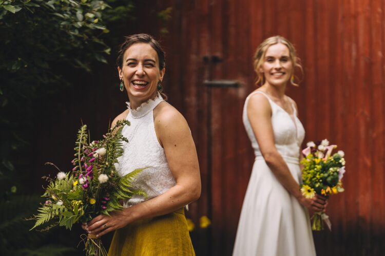 LGBTQ wedding photographer two brides radiating happiness and love