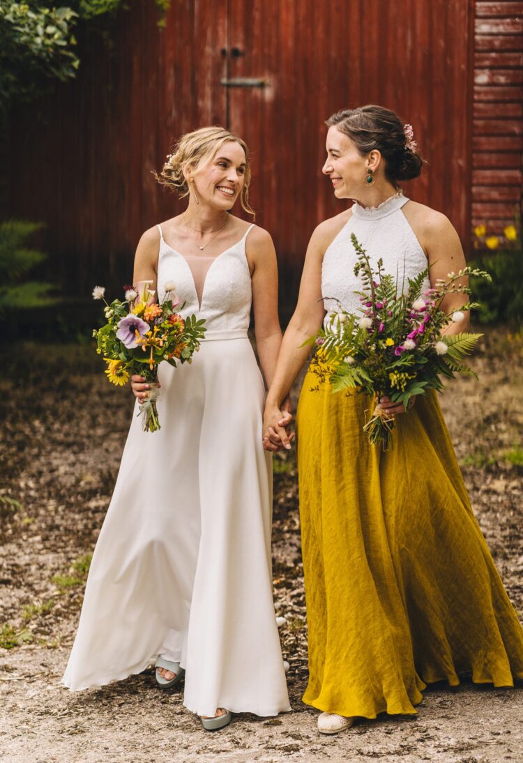 LGBTQ wedding photographer two brides radiating happiness and love