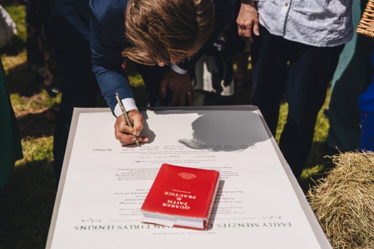 signing the quaker wedding ceremony certificate