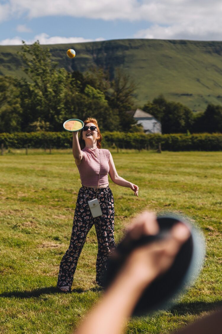 garden games and guests having fun during wedding reception LGBTQ wedding in the Black Mountains