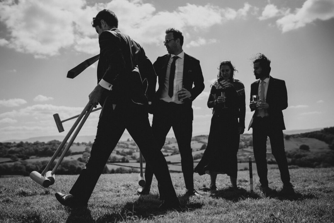 garden games and guests having fun during wedding reception LGBTQ wedding in the Black Mountains