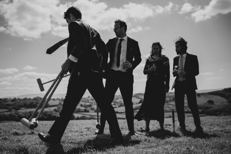 garden games and guests having fun during wedding reception LGBTQ wedding in the Black Mountains