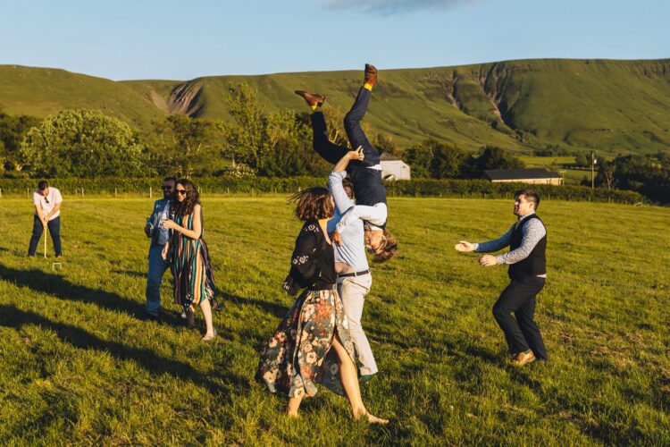 garden games and guests having fun during wedding reception LGBTQ wedding in the Black Mountains