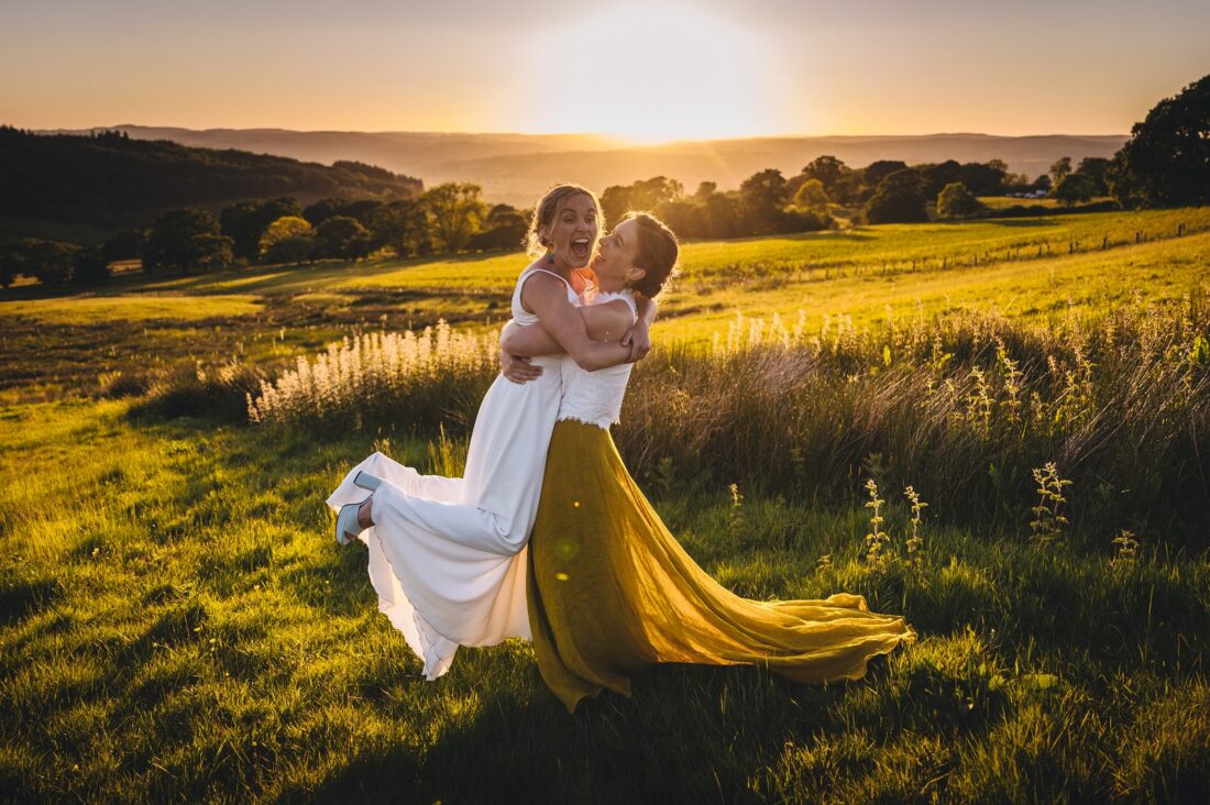 LGBTQ wedding photographer two brides in the golden hour radiating happiness and love