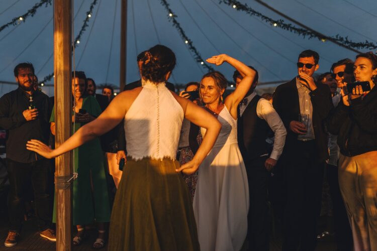 LGBTQ wedding photographer brides having the first dance in the golden hour