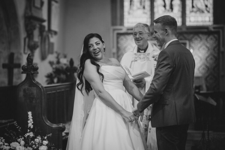 church ceremony over barn wedding photography