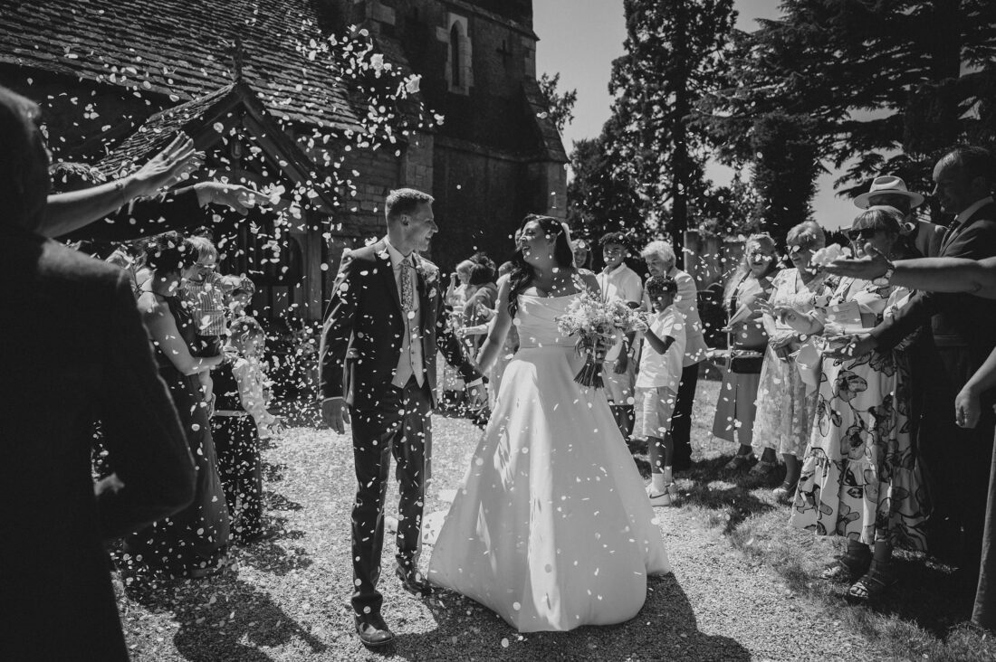 confetti moment over barn wedding photography