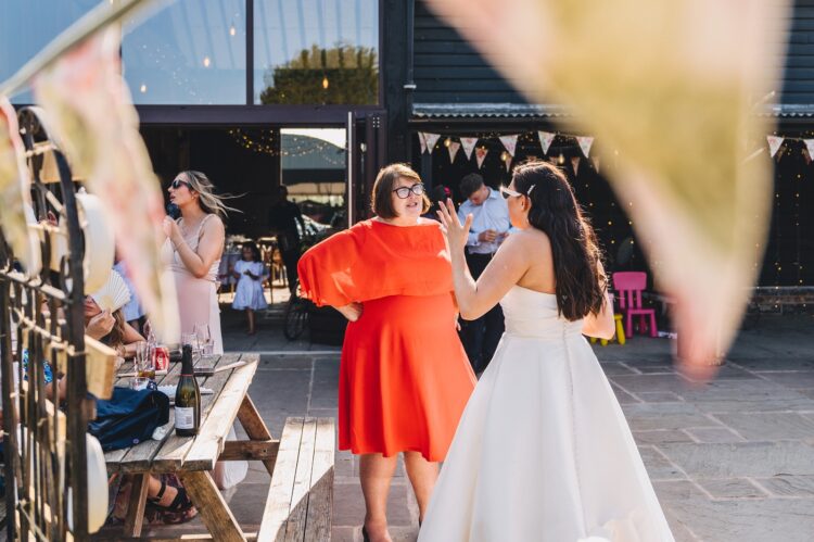 reception drinks and guests having fun at Over Barn