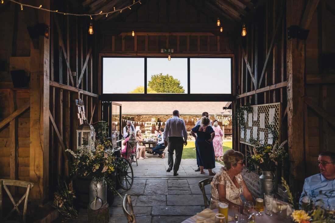 reception drinks and guests having fun at Over Barn