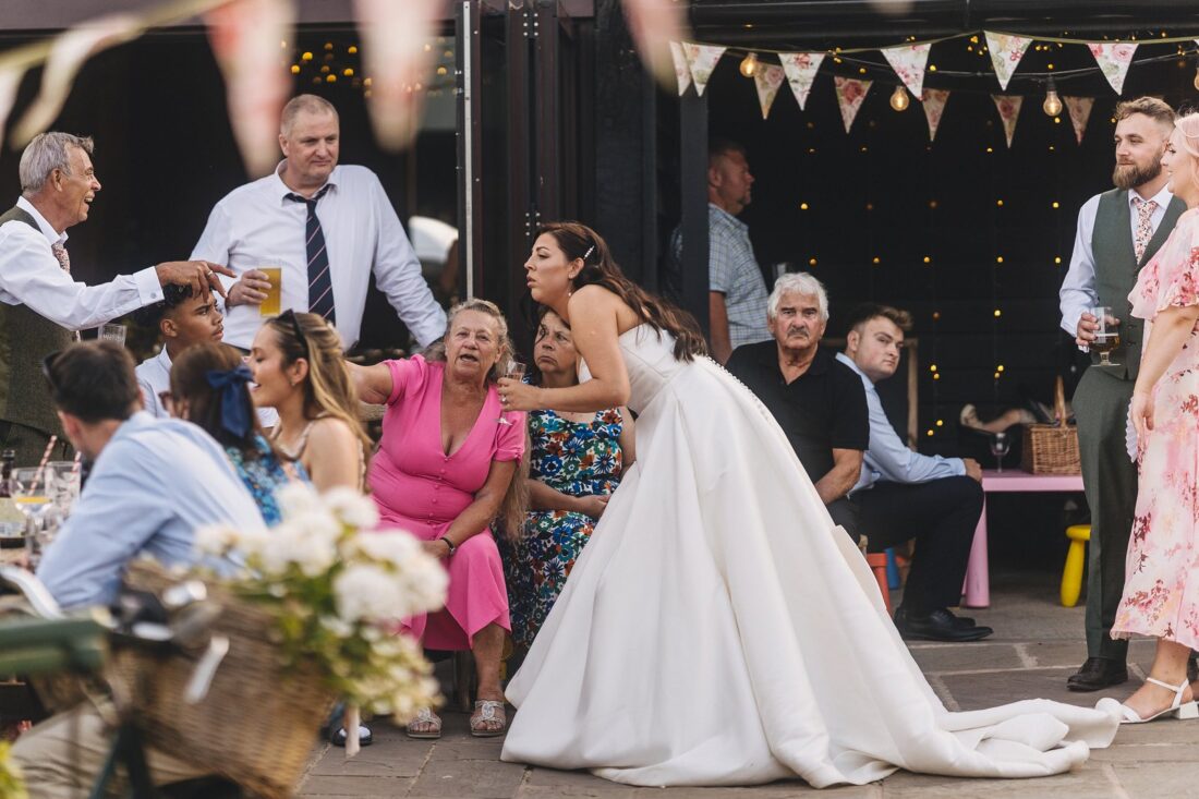 reception drinks and guests having fun at Over Barn