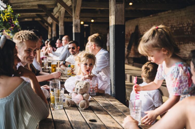 reception drinks and guests having fun at Over Barn