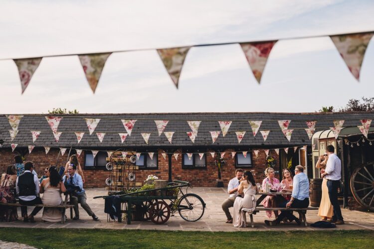reception drinks and guests having fun at Over Barn