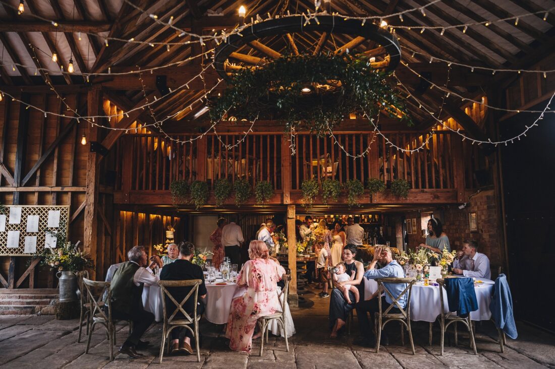reception drinks and guests having fun at Over Barn