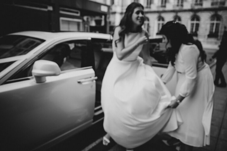wedding guests ariving at the army and navy club pall mall london