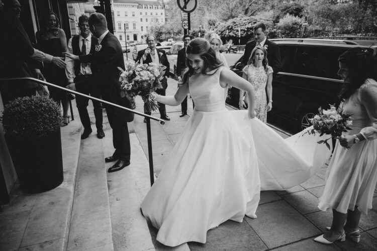 wedding guests ariving at the army and navy club pall mall london