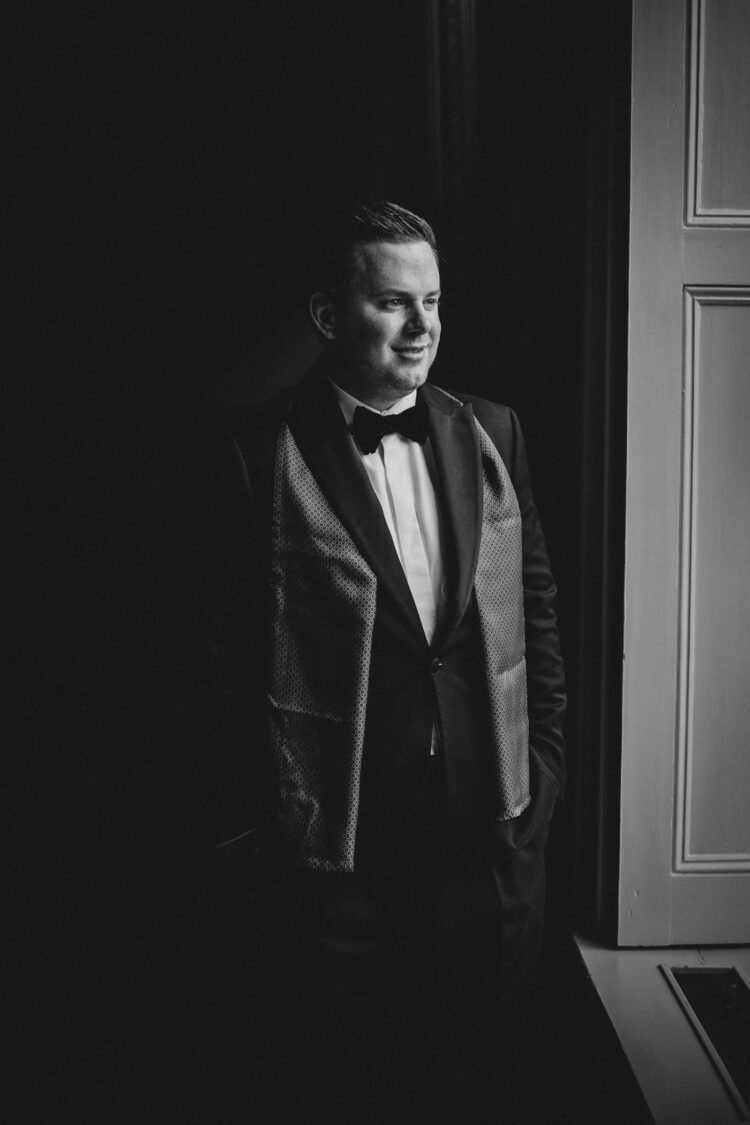 groom getting ready at Dewsall Court