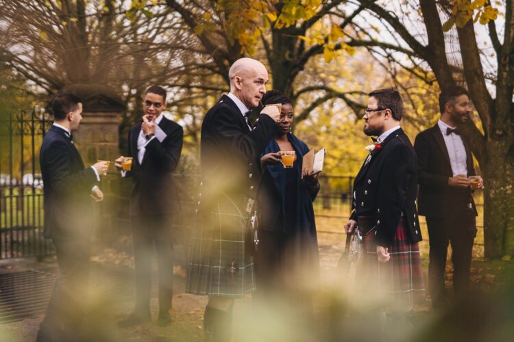 groom welcoming guests at Dewsall Court