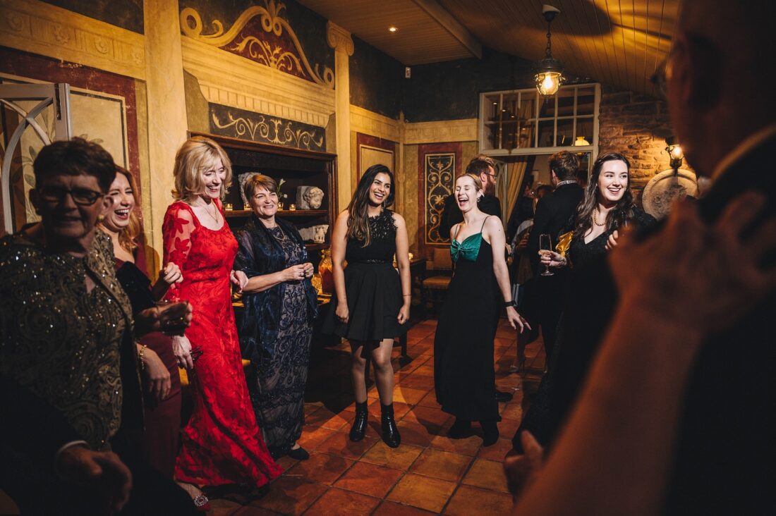 wedding fun during reception drinks at Dewsall Court